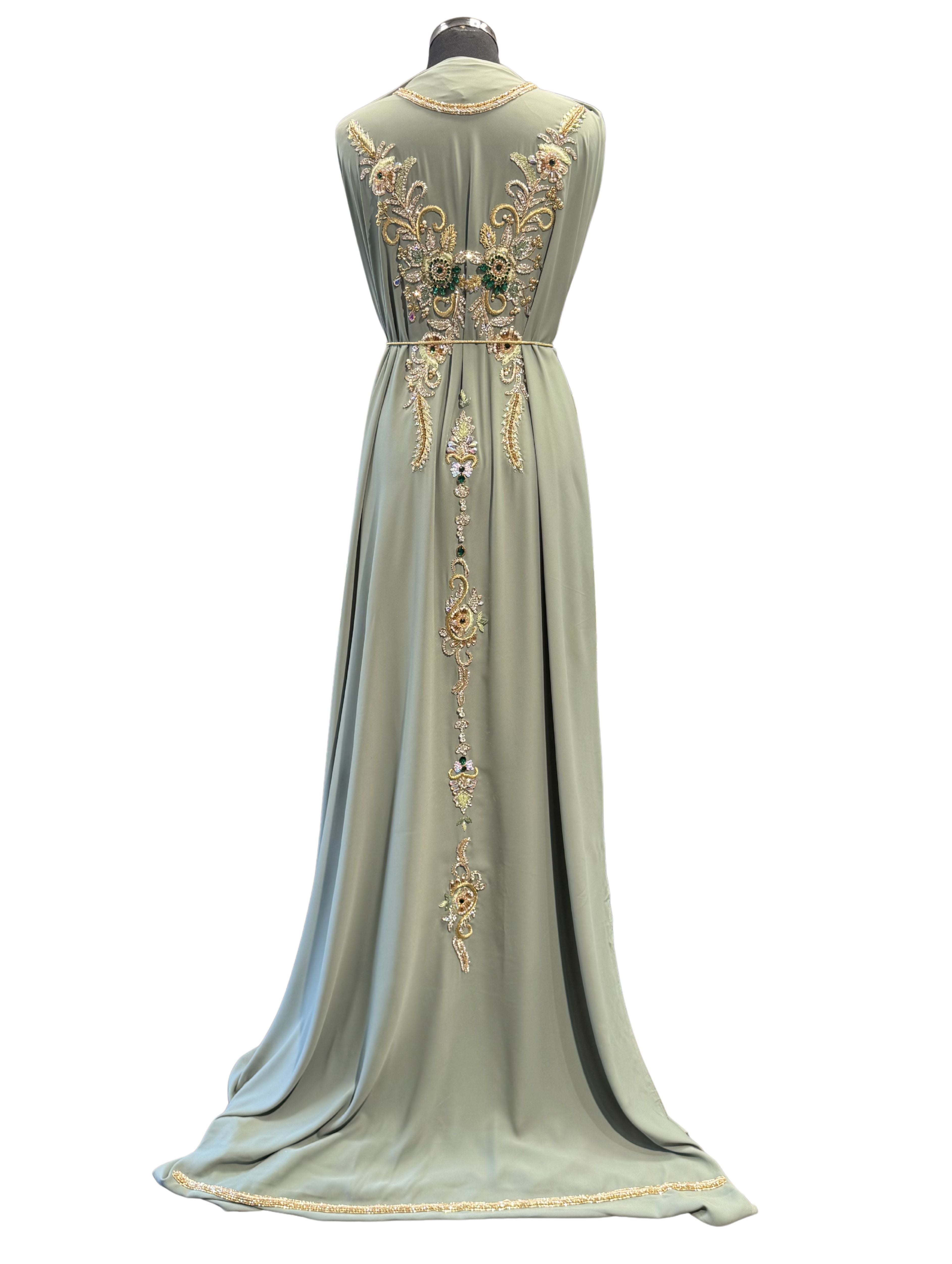 Achterkant van vintage mintgroene crêpe takshita stof met bewerking.