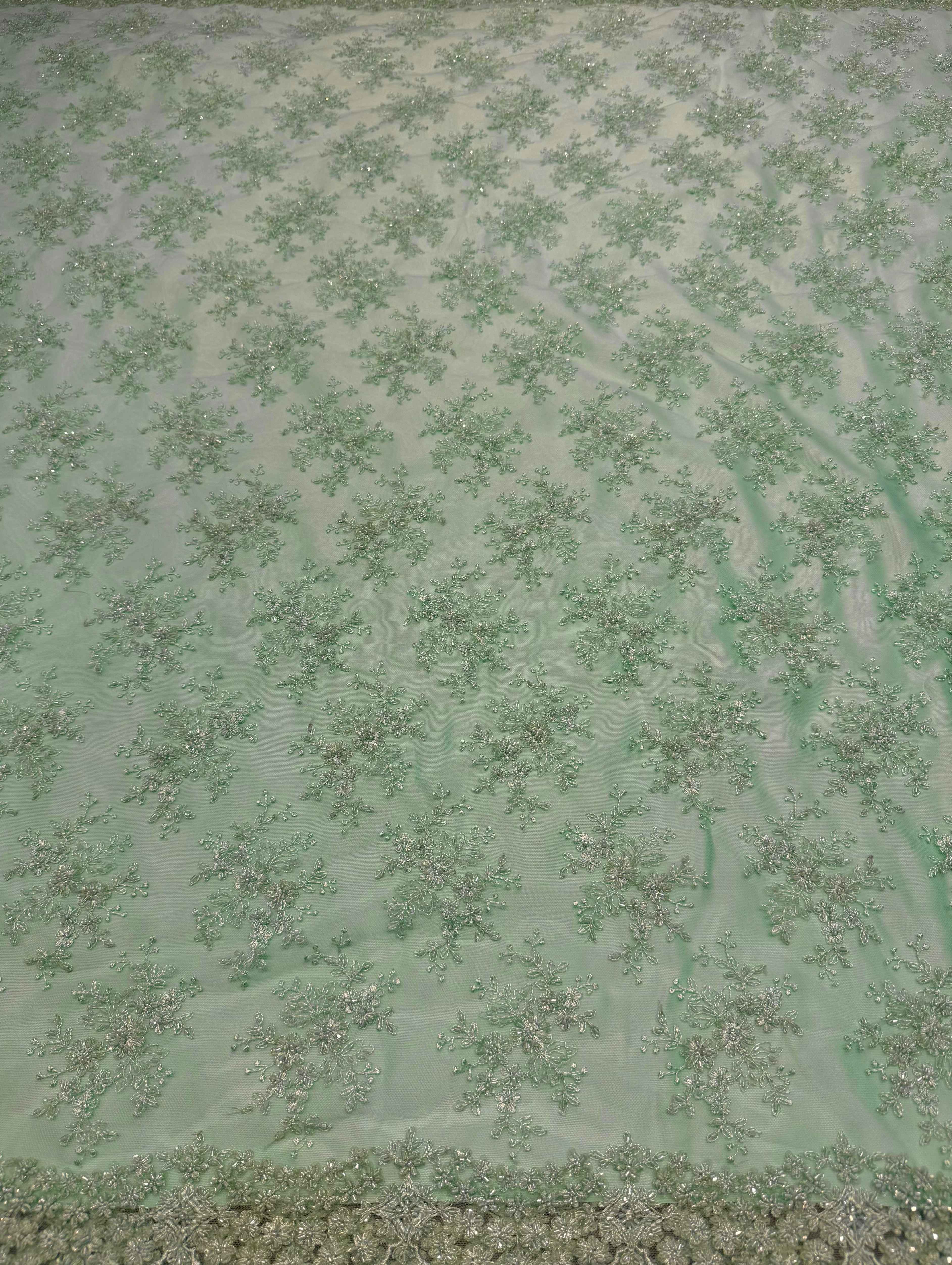 Mintgroene kant stof met elegante kantstructuur, geschikt voor avondjurken, takshita, dirac en xeftan